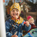 Child laughs in sunshine